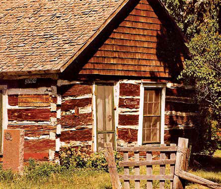Sam Deon’s cabin, built in 1858, still stands just south of the LaPorte post office. Photo by Bill Lambdin years ago.