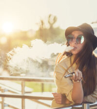 Young woman vaping